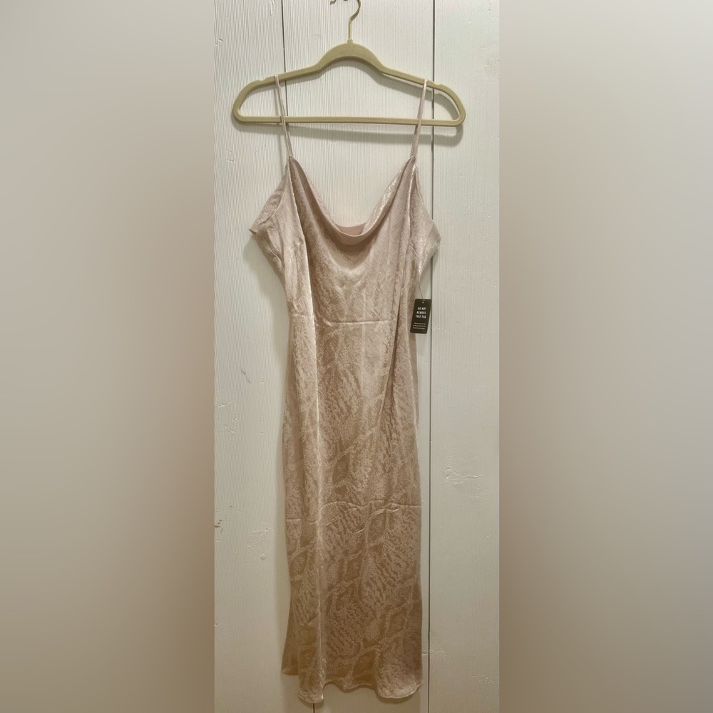Never worn Express nude printed slip dress. Size XL.